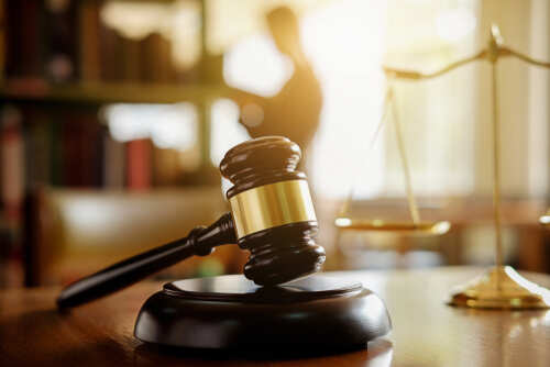 Judge,Gavel,With,Justice,Lawyers,Having,Team,Meeting,At,Law