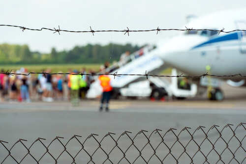 A,Plane,On,The,Territory,Of,The,Airport,Against,The