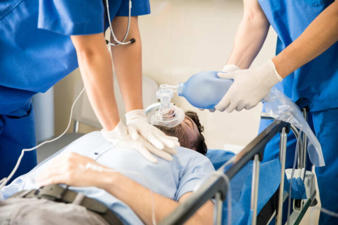 Hands,Of,Doctors,Giving,Cardiac,Massage,And,Resuscitation,To,A