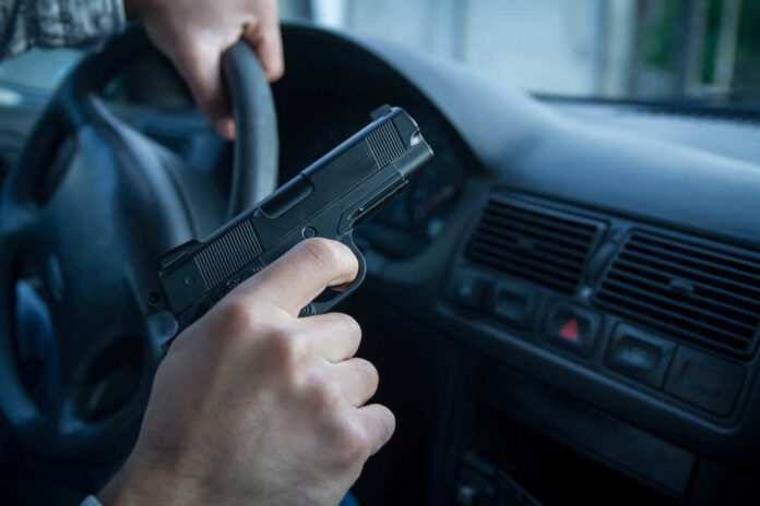 Man,In,Black,Balaclava,With,Handgun,Driving,A,Car.