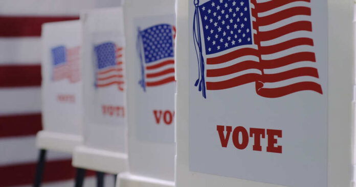Straight,On,Row,Of,Voting,Booths,At,Polling,Station,During