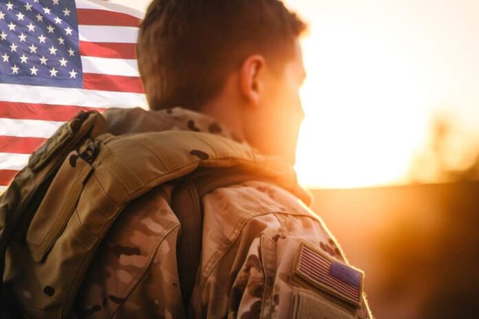 Rear,View,Of,A,U.s.,Soldier,Looking,At,The,Sunset