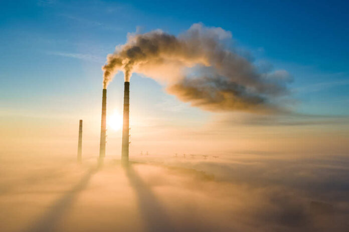 Aerial,View,Of,Coal,Power,Plant,High,Pipes,With,Black