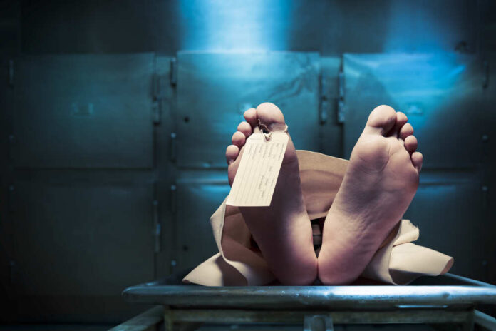Grungy,Photo,Of,Feet,With,Toe,Tag,On,A,Morgue