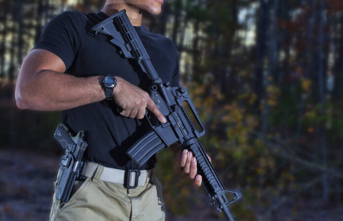 Man,With,A,Semi,Automatic,Rifle,And,Handgun,In,The