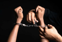 Suburban Moms’ Arrest SHOCKER — Not By ICE! Hands in handcuffs being unlocked with key