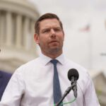 Residency Rule Nightmare for Swalwell? A politician speaking at a press conference outside the Capitol building