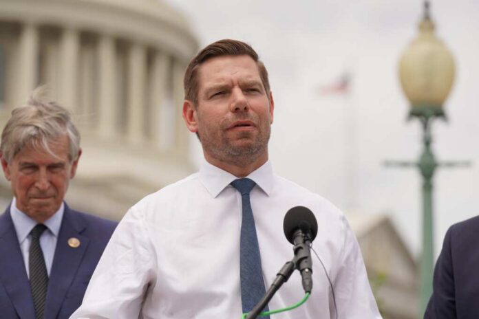 A politician speaking at a press conference outside the Capitol building