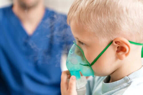 breathing-problem2065132409jpg Child using nebulizer mask for breathing treatment