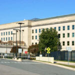 Exterior view of the Pentagon building with clear blue sky