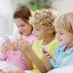 Google’s Dire Warning: Bans Push Kids Into Internet Wilds Three children sitting together, each using a smartphone