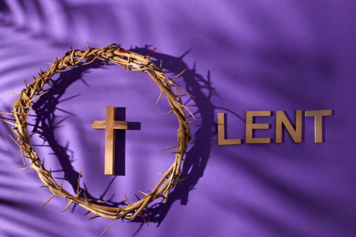 Crown of thorns and wooden cross with the word 'LENT' on a purple background