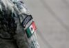 Close-up of a military uniform sleeve featuring the Mexico flag