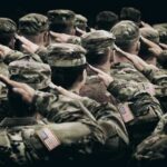 Troop Refusal SHOCKS Military — Hidden Mobilization? Group of soldiers in uniform saluting during a ceremony