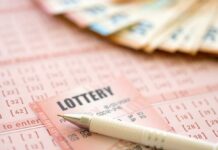 Massive Fortune in Limbo – Deadline Ticks Down Close-up of lottery tickets and cash with a pen