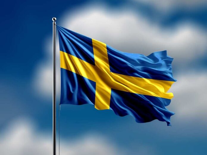 Waving flag of Sweden against a blue sky