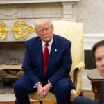 Trump’s Iran Strategy: A Peaceful Solution or Propaganda? A serious-looking man in a suit sitting in a presidential office during a meeting