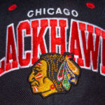 Close-up of a Chicago Blackhawks baseball cap featuring the team logo