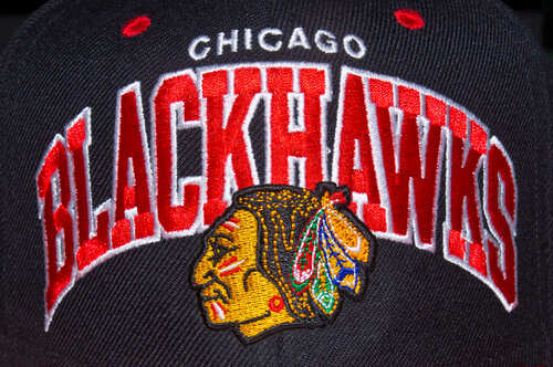 Close-up of a Chicago Blackhawks baseball cap featuring the team logo