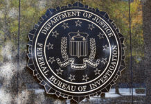 FBI seal on a concrete wall outdoors