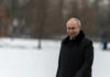 Putin’s Dream Plan: Is NATO Falling Apart? Person in dark coat standing on snowcovered ground
