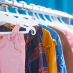 Lead-Laden Shirts: Urgent Warning for Parents A variety of children's clothing hanging on a rack