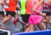 Blind Runner’s AI Glasses Stunt – Revolutionary or Reckless? Runners in colorful athletic wear participating in a race