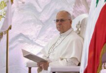 Easter CALL-OUT: Pope’s Peace Plea to U.S. Pope seated in a ceremonial chair with flags in the background