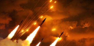 Multiple rockets launching into a fiery sky