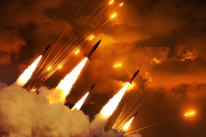 shutterstock_2745679603.jpg Multiple rockets launching into a fiery sky