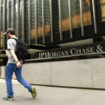 Trump vs. Woke Banks: Game-Changer Order! Man walking past JPMorgan Chase & Co. building facade