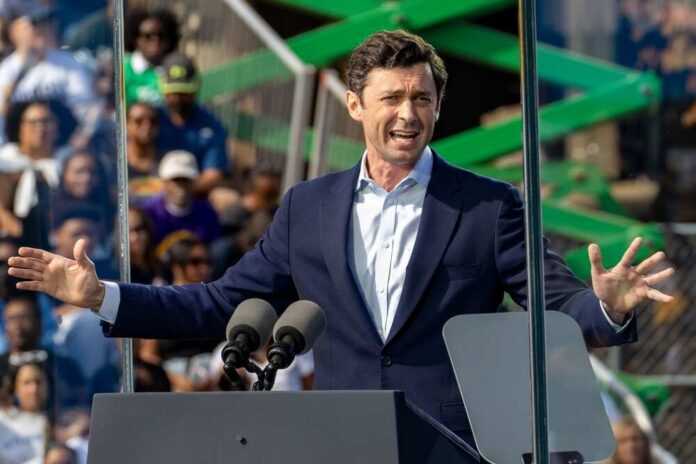 A speaker passionately addressing a crowd at an outdoor event