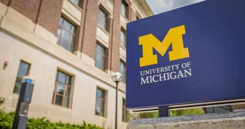 University of Michigan sign outside brick building