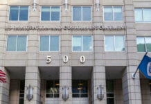 US Immigration and Customs Enforcement building entrance flags