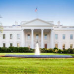 The White House with lawn and fountain.