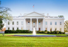 The White House with lawn and fountain.