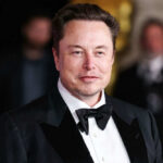 man in a black tuxedo and bow tie