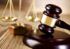 The Chilling Prediction Behind The Sentence Wooden gavel and scales of justice on table