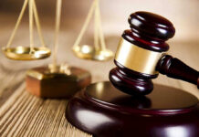 The Chilling Prediction Behind The Sentence Wooden gavel and scales of justice on table