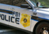 FBI police patrol car side with badge and markings