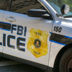 FBI police patrol car side with badge and markings