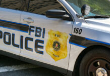 FBI police patrol car side with badge and markings