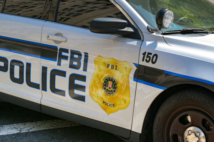 FBI police patrol car side with badge and markings