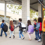 Another Battle Over Parental Rights Emerges Group of children walking towards a school bus