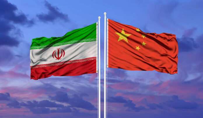 Iran,And,China,Flag,Waving,In,The,Wind,Against,White Flags of Iran and China waving against a colorful sky
