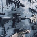 A wall displaying various firearms in a gun shop