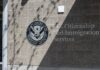 Signage for U.S. Citizenship and Immigration Services on a building