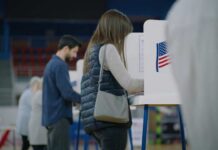 Who Votes Now? LA Drops The Guardrails A person casting their vote at a polling station