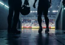 Football players standing in a tunnel before entering the stadium