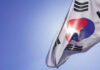 South Korean flag waving against a clear blue sky